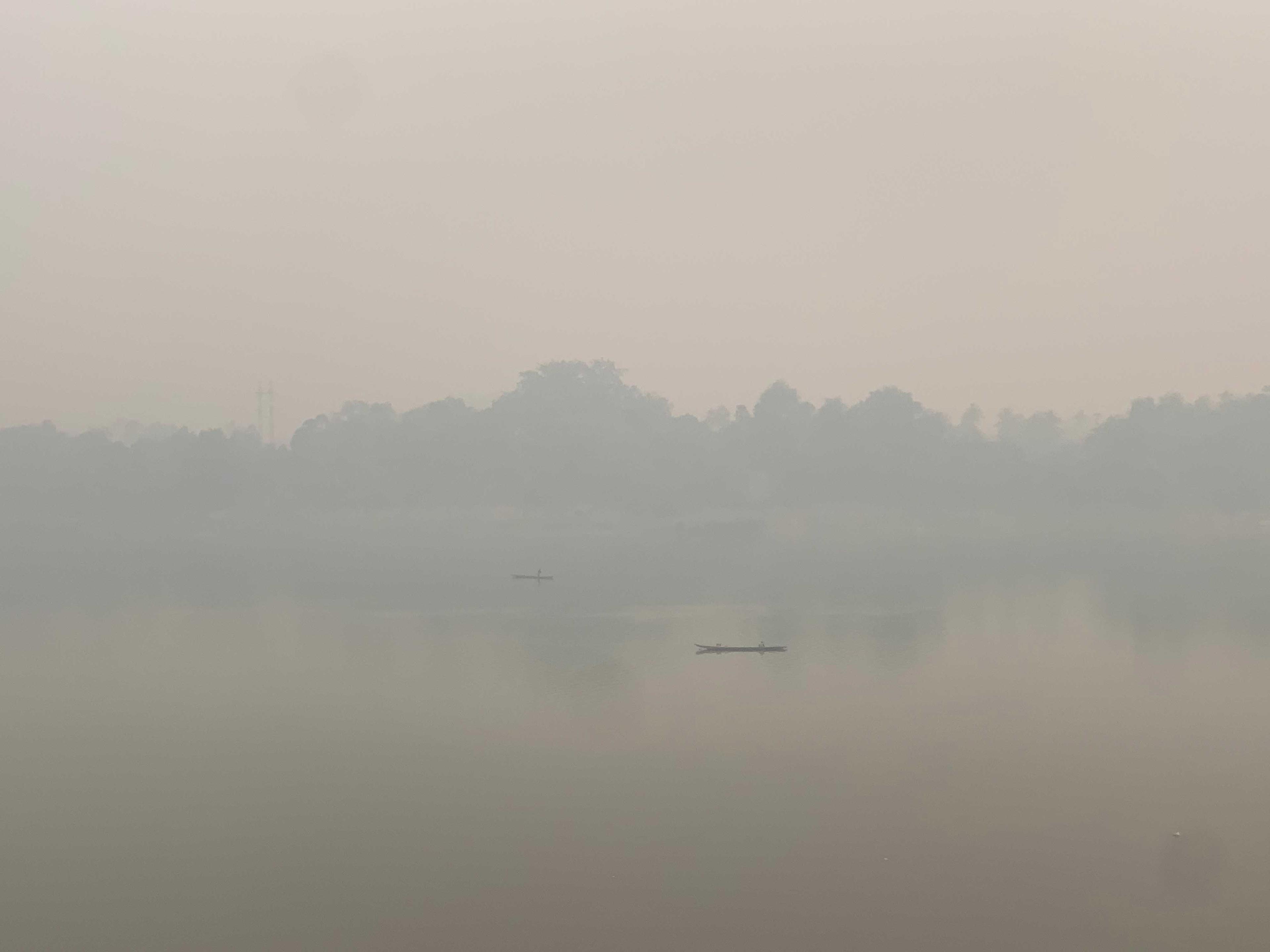 Mekong River in Luang Prabhang, covered by smoke