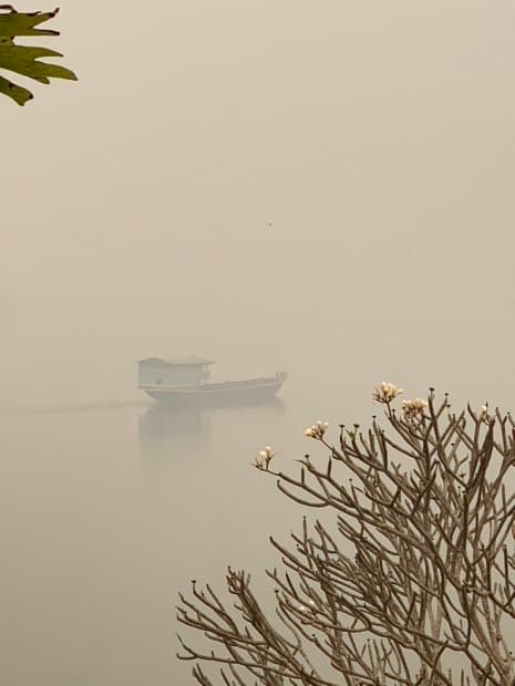 Luang Prabang - burning season 1 The Mekong River in Luang Prabhang covered by smoke