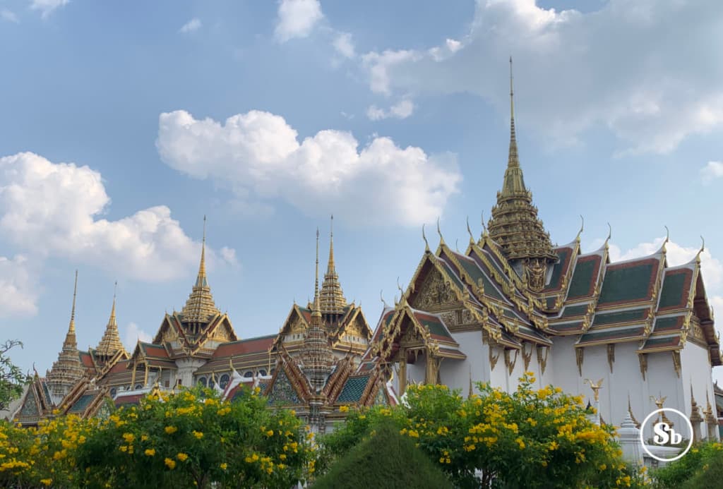 Royal Palace, Bangkok
View of the Bangkok Royal Palace complex. The photo mainly reveals the roofs of the various buildings. All the roofs have the typical Thai structure with "rising triangles" and are decorated with gold and red edges, and the central part colored emerald green. At the top of each roof, it's possible to admire a golden stupa.